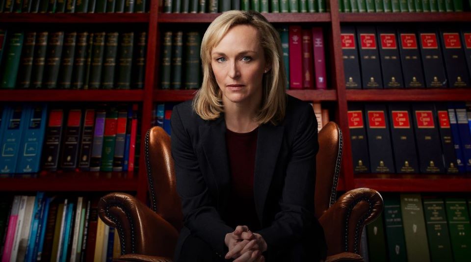 Caroline Craig with bookshelves