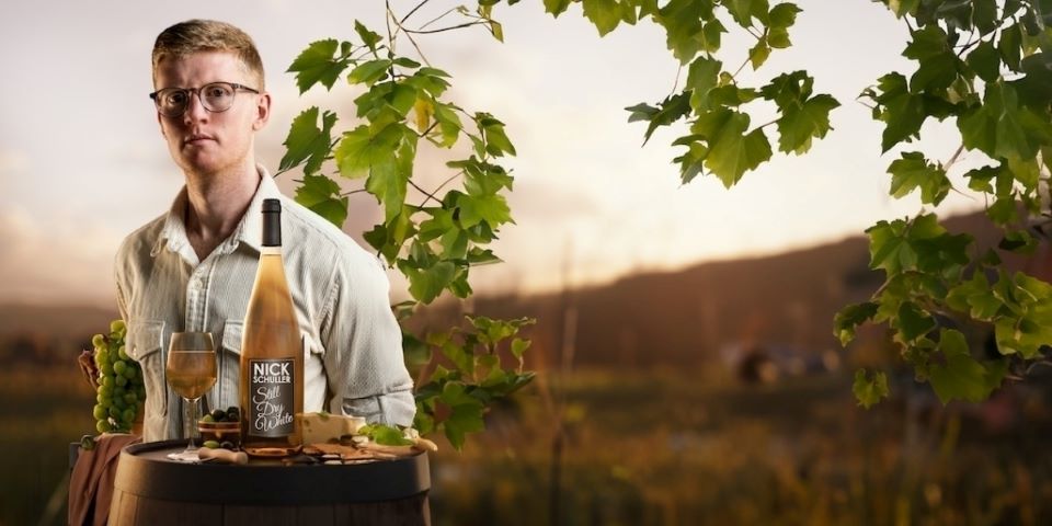 man holding tray of wine