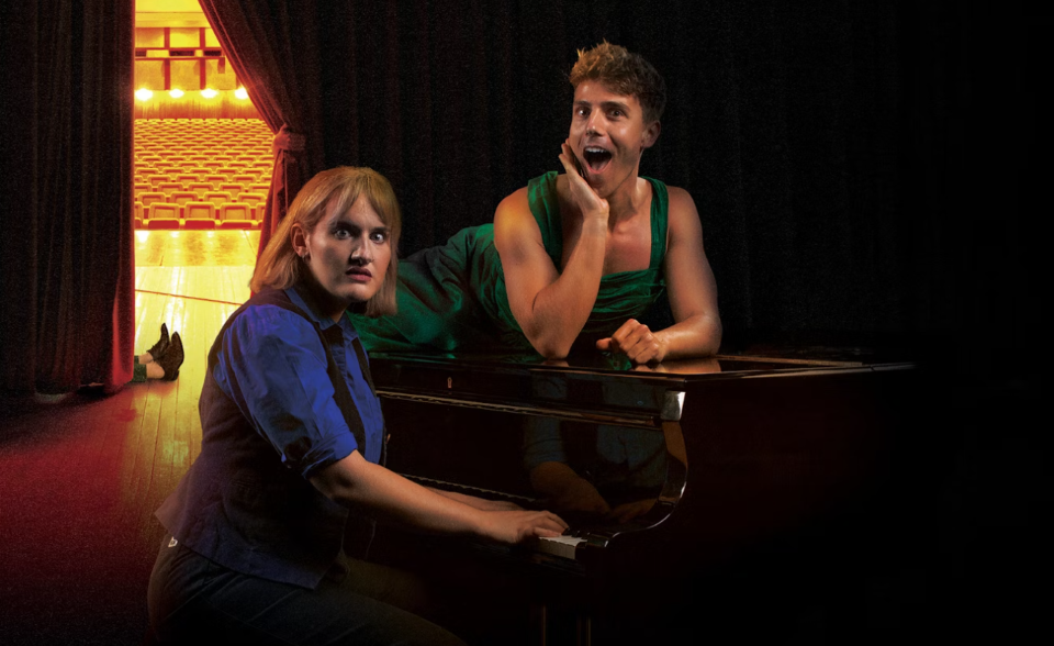 Two people at piano