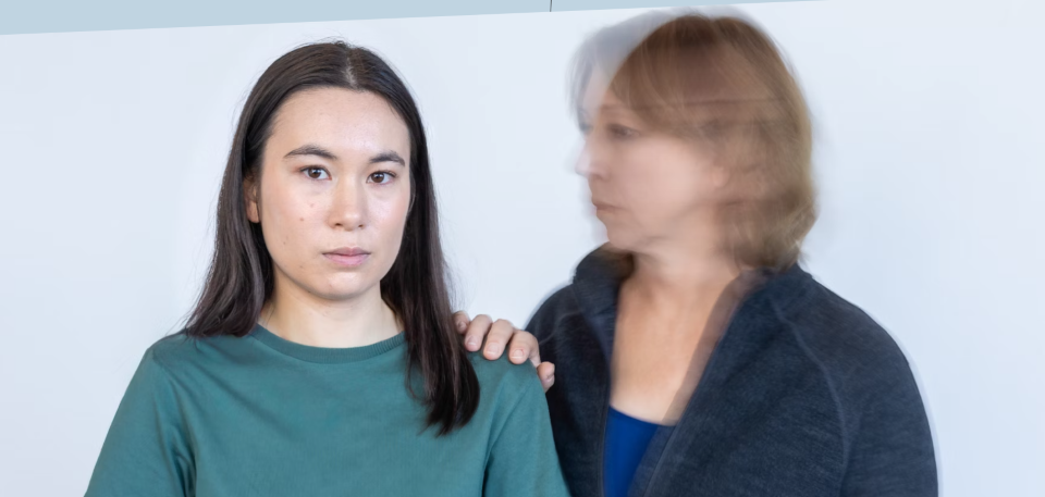 two women - one blurred