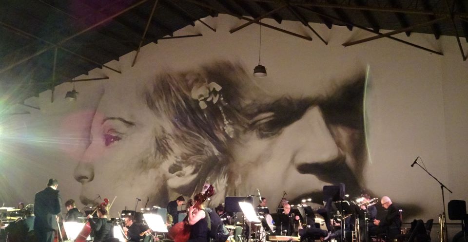 mural behind orchestra