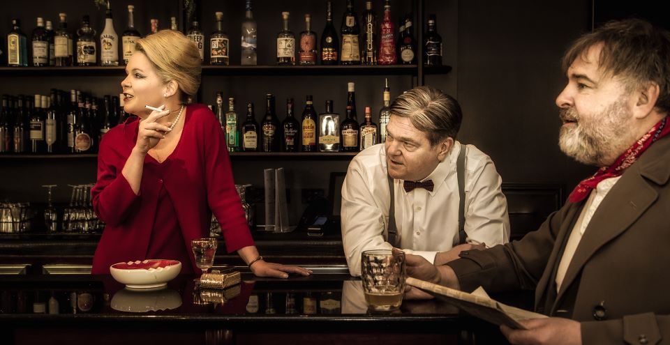 2 men and woman in bar