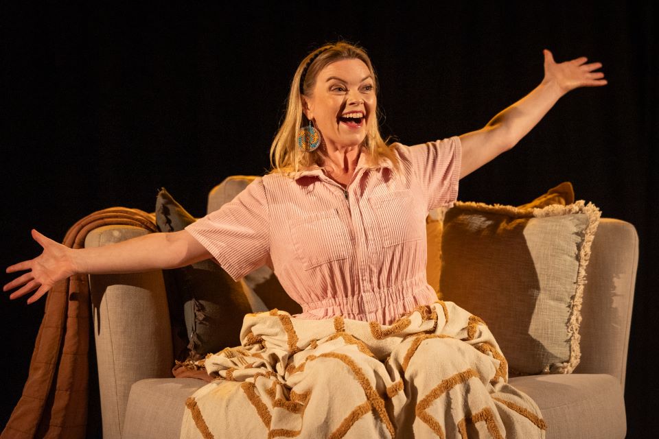 woman with arms outstretched