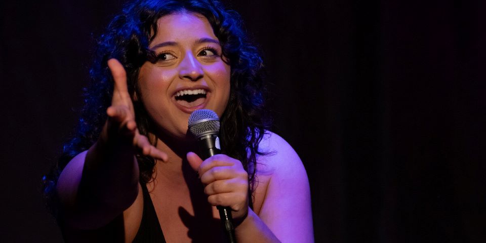 woman singing with microphone