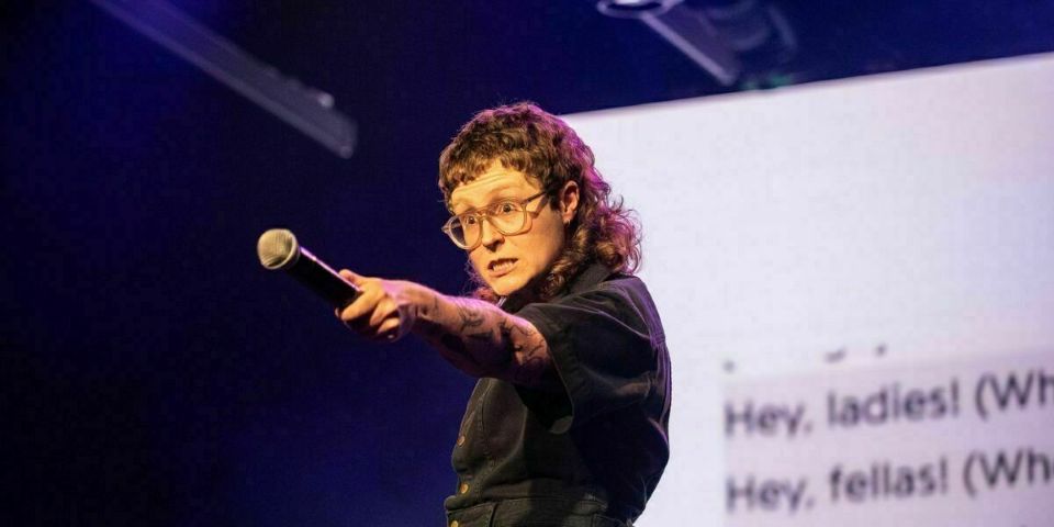 women pointing microphone