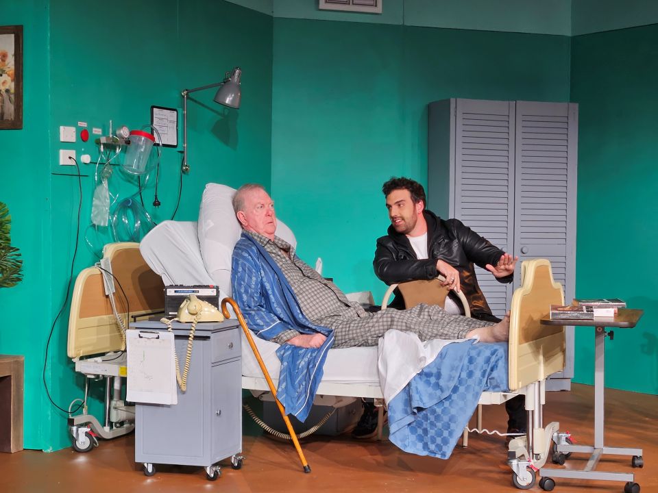 man in hospital bed