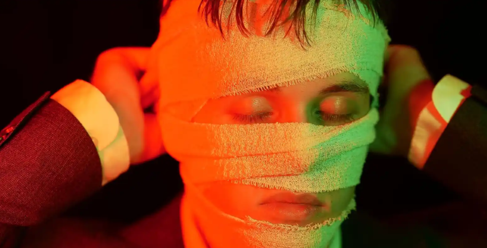 man with bandaged face