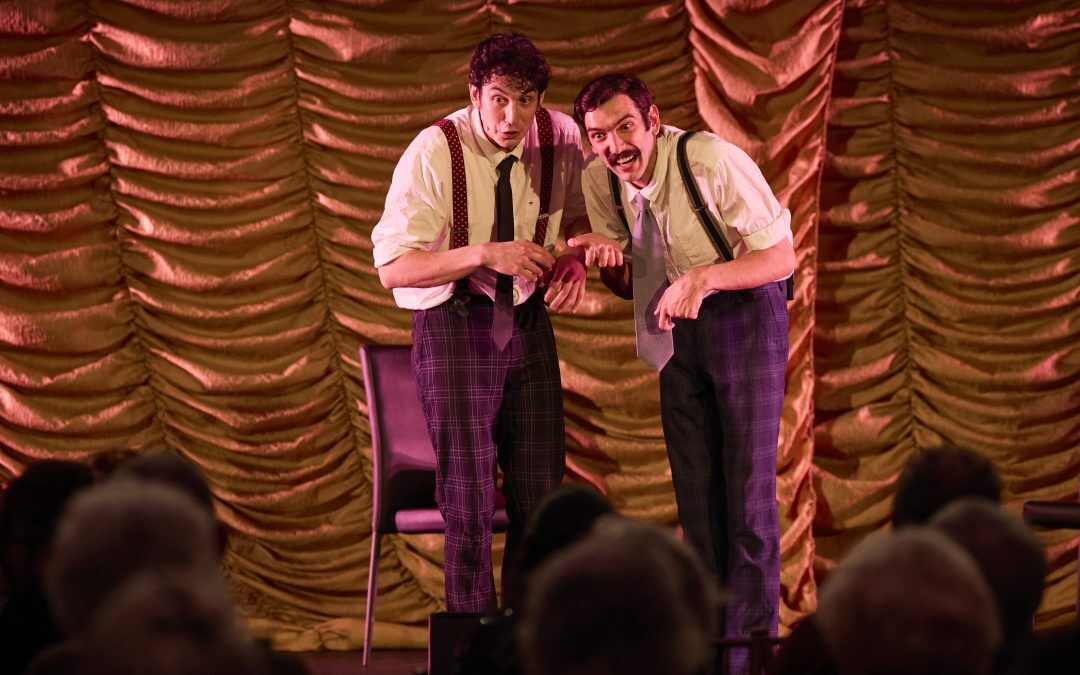 2 men singing