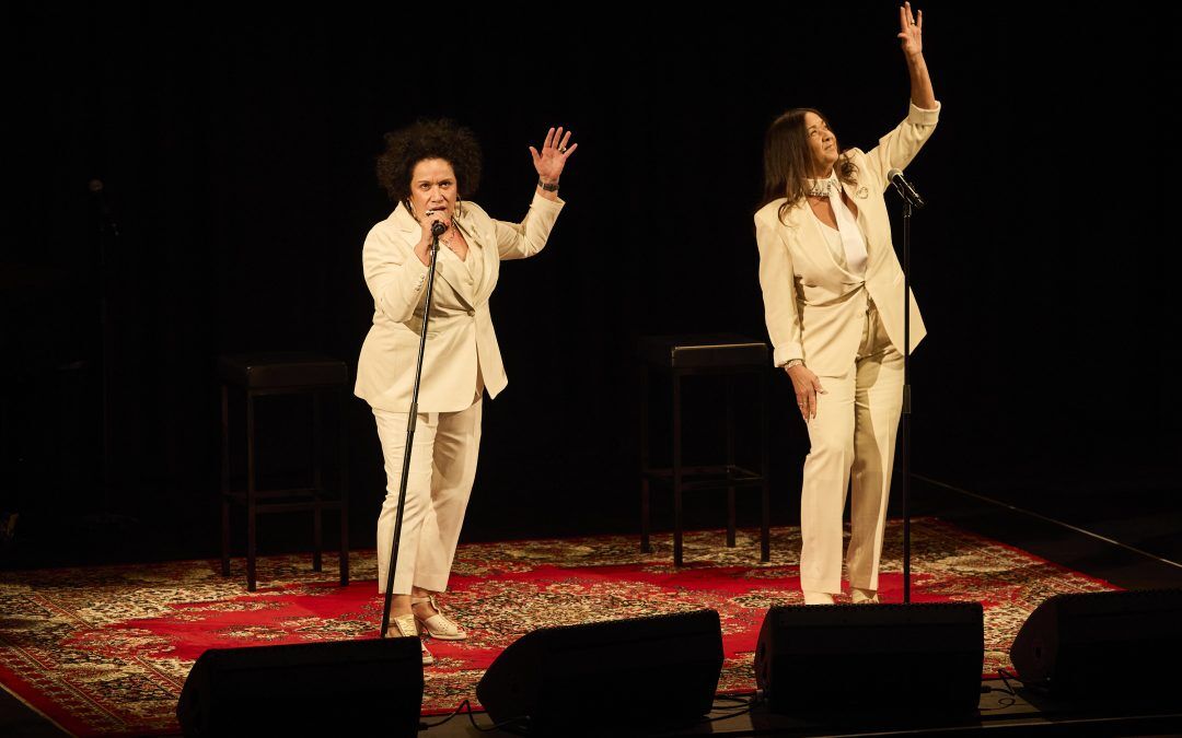 2 women singing