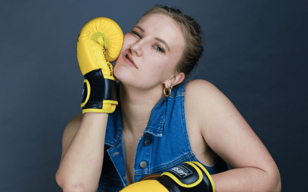 Millicent Sarre wearing boxing gloves