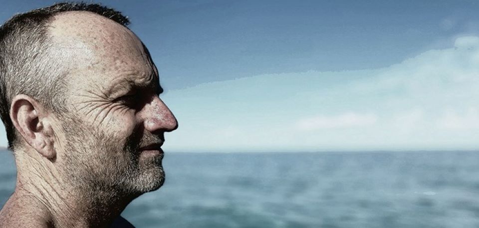 Profile of man by the sea